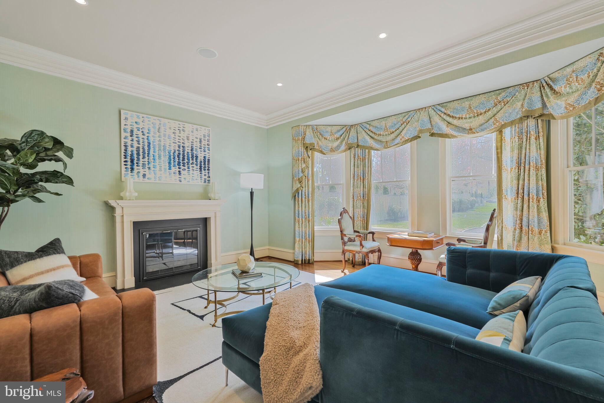 833 Herbert Springs Road Alexandria, VA 22308 - Photo 5 of 34 a living room with furniture and a fireplace