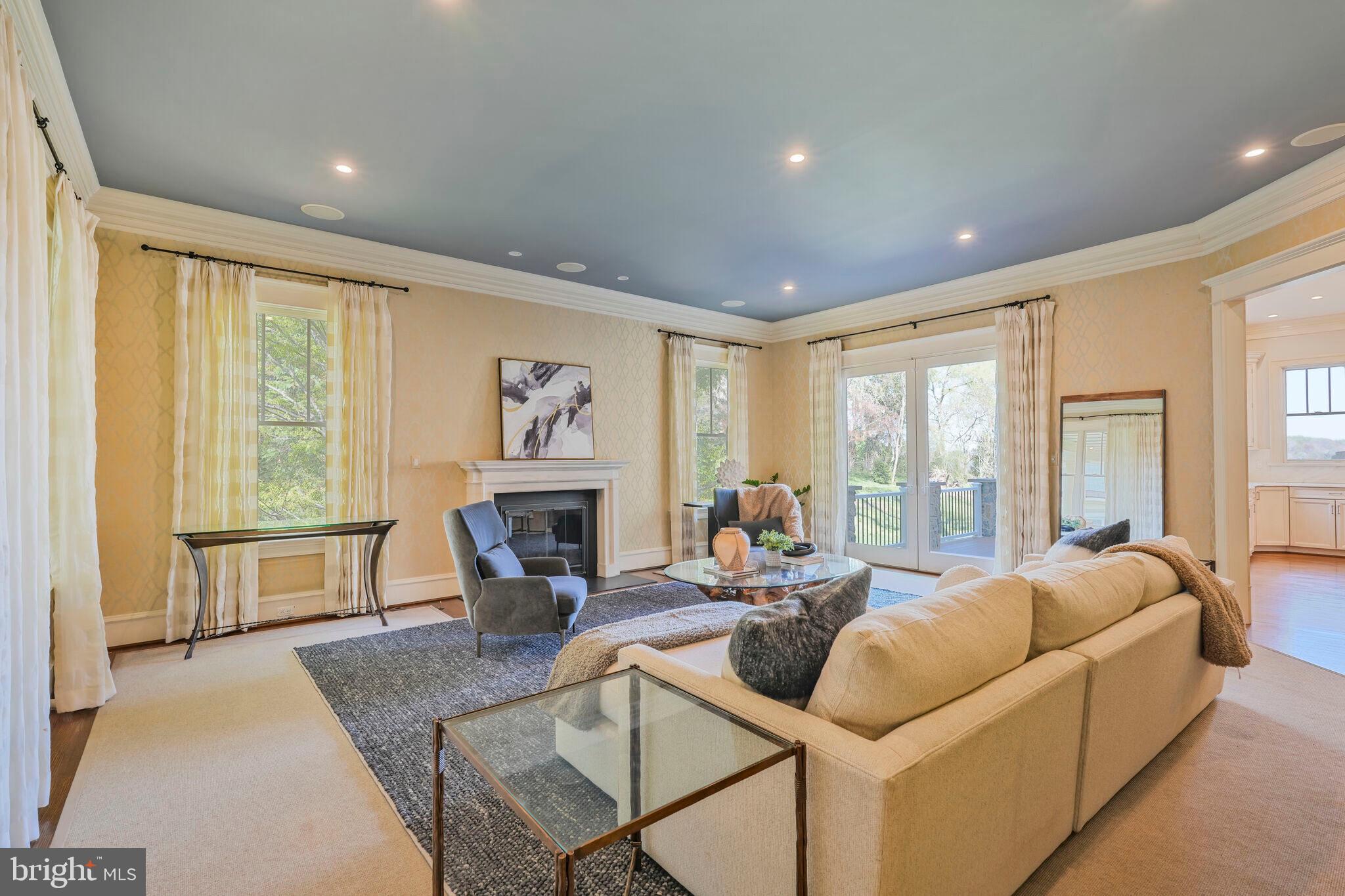 833 Herbert Springs Road Alexandria, VA 22308 - Photo 9 of 34 a living room with fireplace furniture and a large window