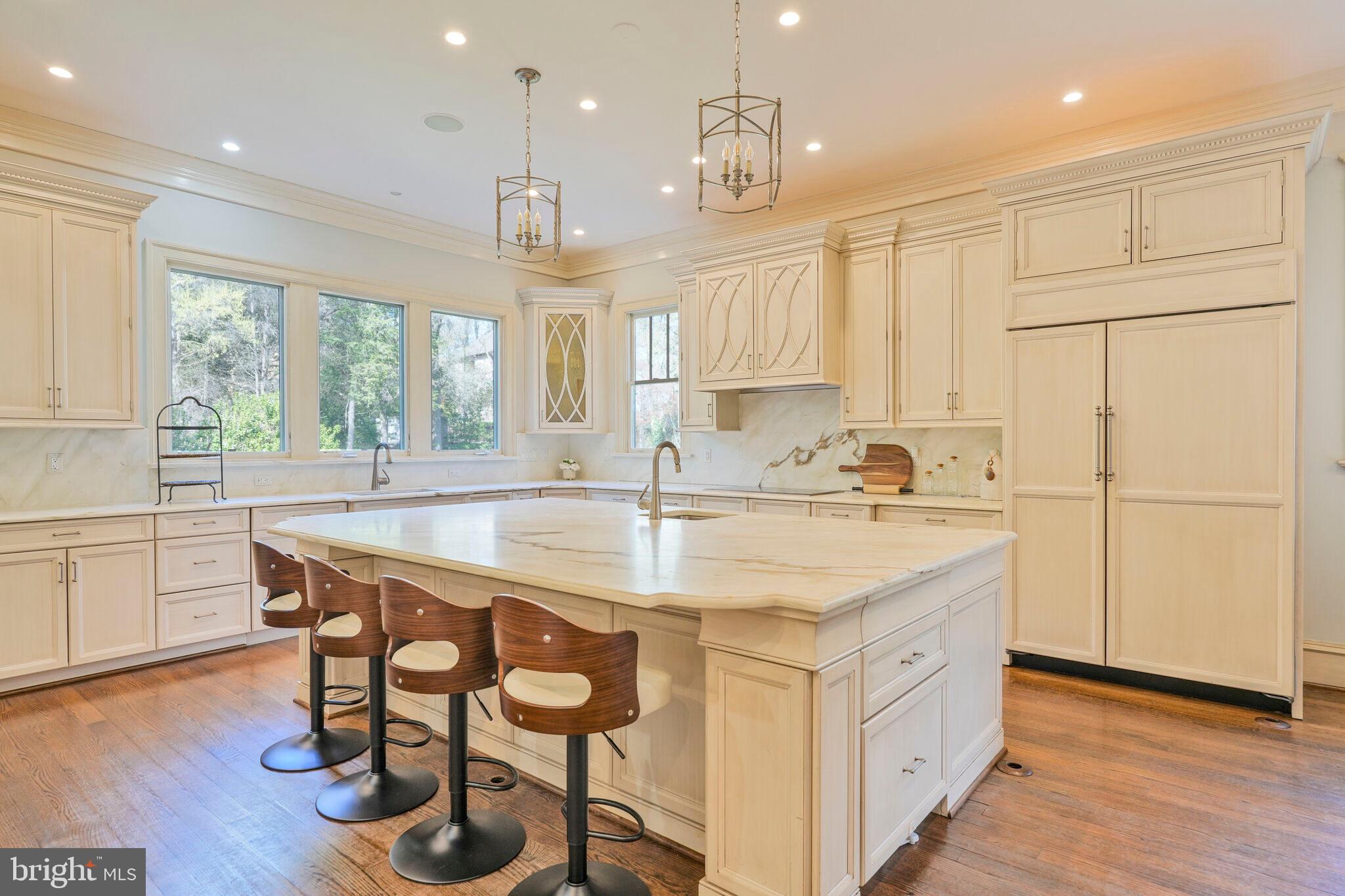 833 Herbert Springs Road Alexandria, VA 22308 - Photo 10 of 34 a kitchen with kitchen island granite countertop a sink a center island and appliances