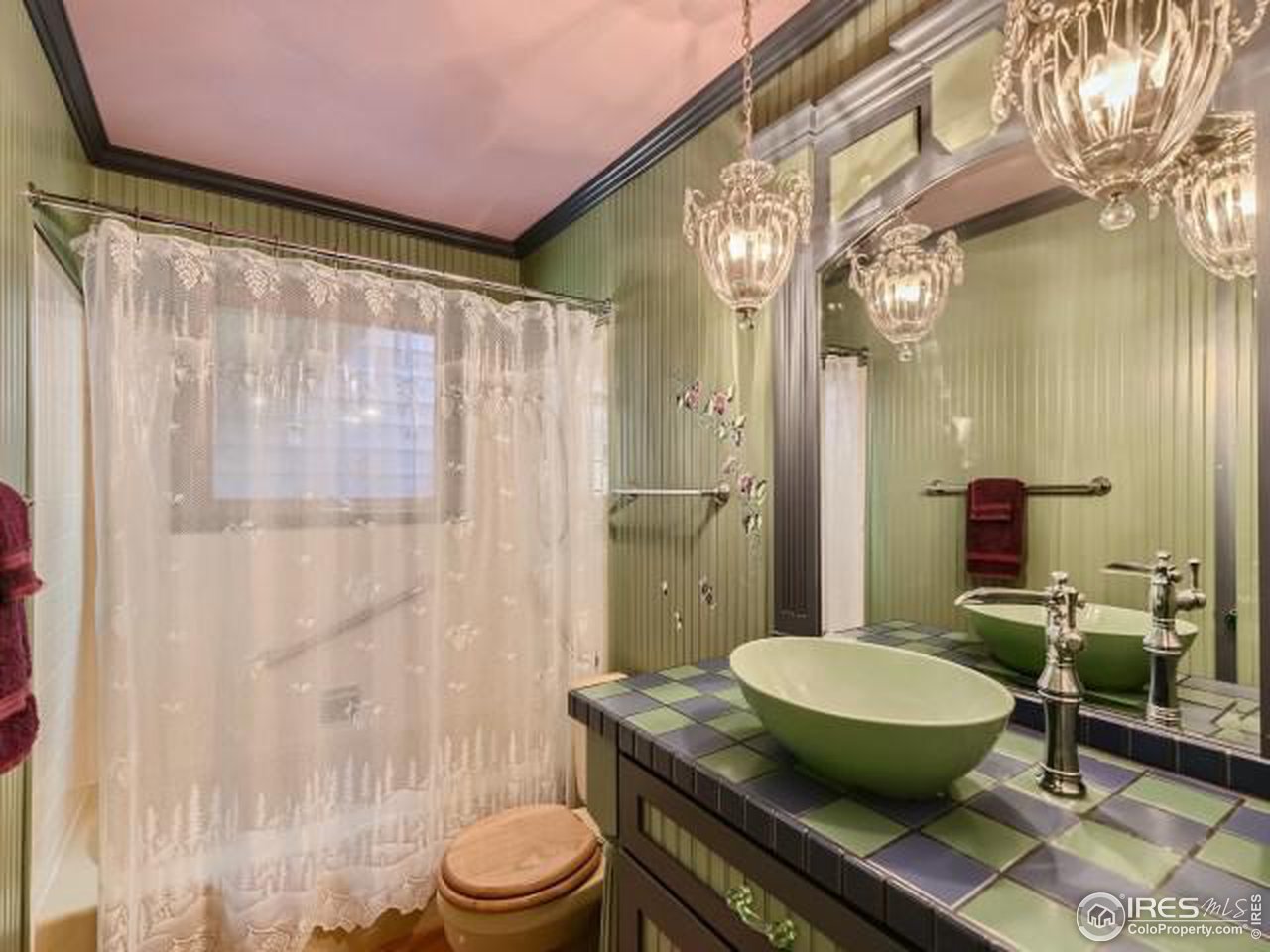 28 Wild Tiger Road Boulder, CO 80302 - Photo 15 of 39 a bathroom with a granite countertop sink toilet a mirror and shower