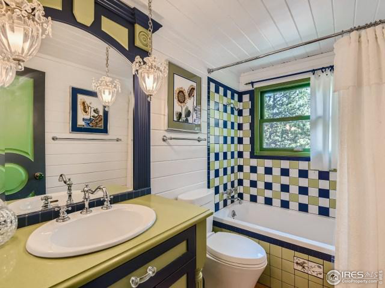 28 Wild Tiger Road Boulder, CO 80302 - Photo 17 of 39 a bathroom with a sink a toilet a mirror a vanity and shower