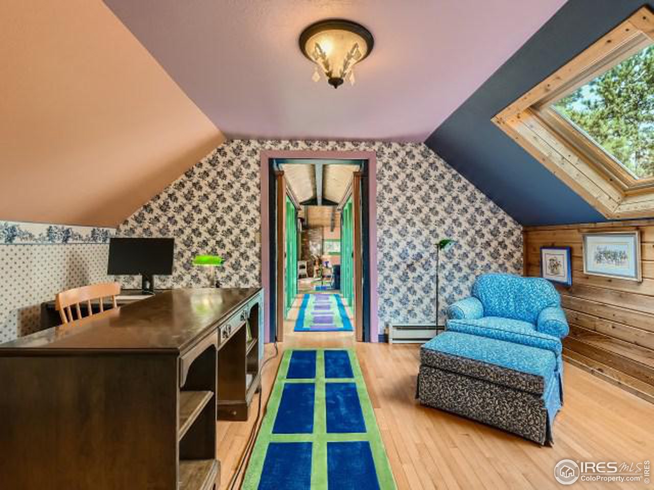 28 Wild Tiger Road Boulder, CO 80302 - Photo 18 of 39 a living room with furniture and a flat screen tv