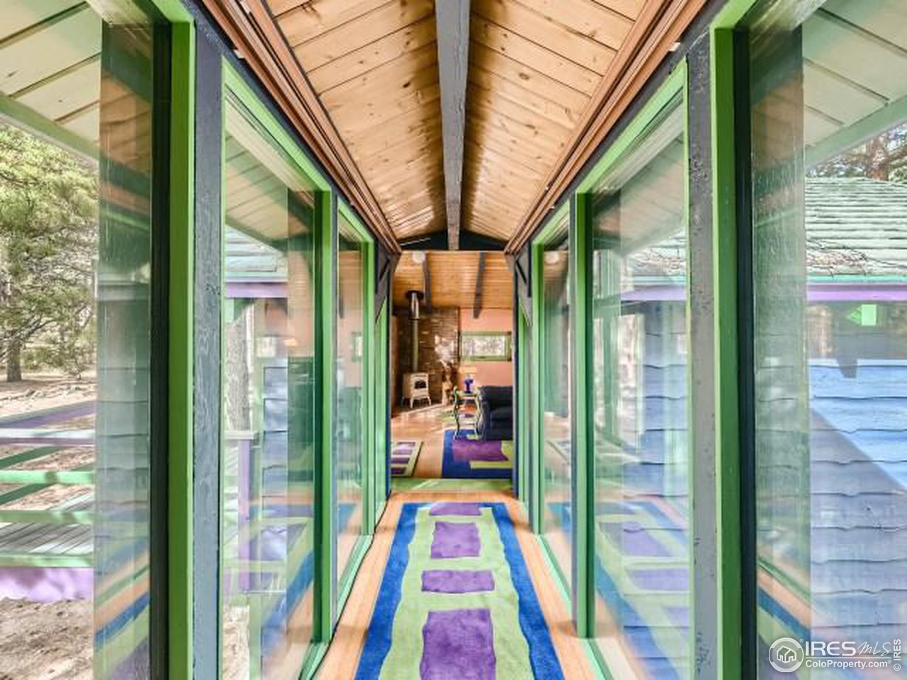 28 Wild Tiger Road Boulder, CO 80302 - Photo 19 of 39 a view of living room with a large window and yard