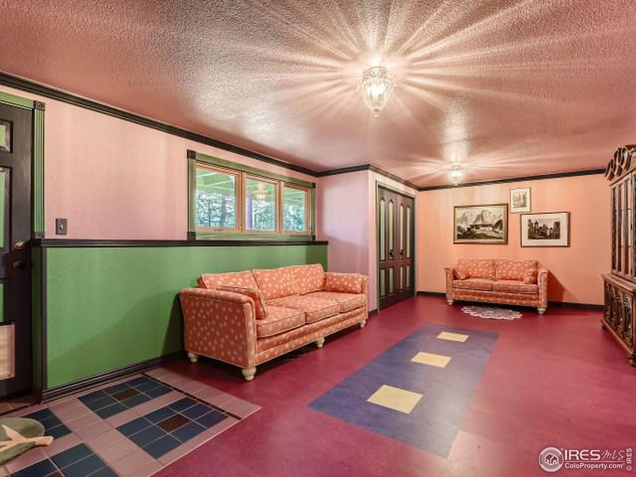 28 Wild Tiger Road Boulder, CO 80302 - Photo 22 of 39 a living room with furniture and a flat screen tv