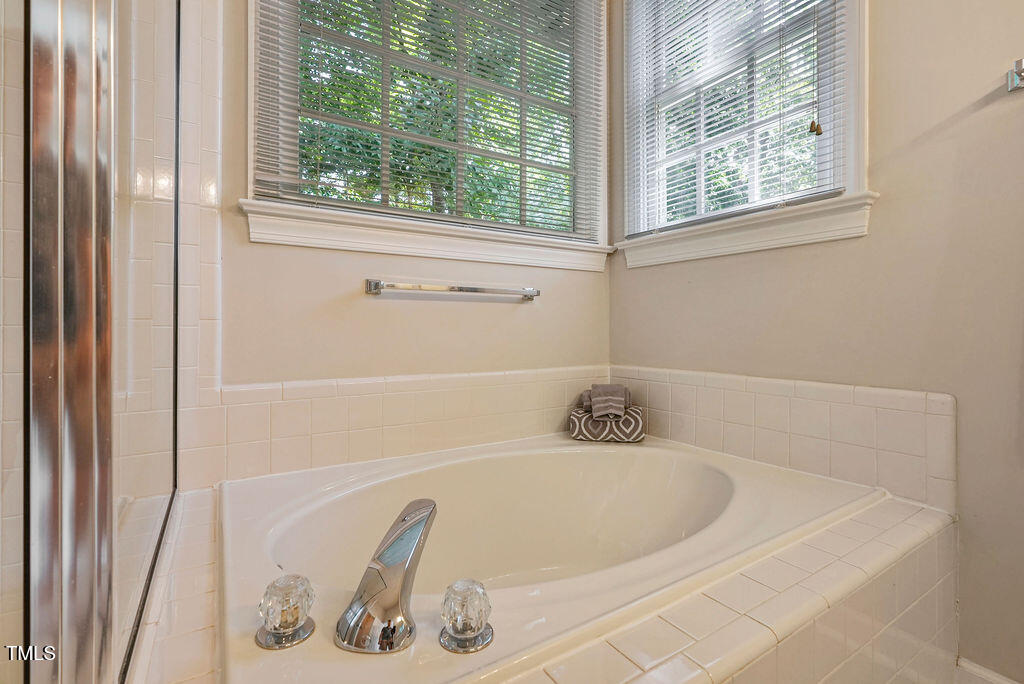 125 Chimney Rise Drive Cary, NC 27511 - Photo 22 of 41 a bath tub sitting next to a window