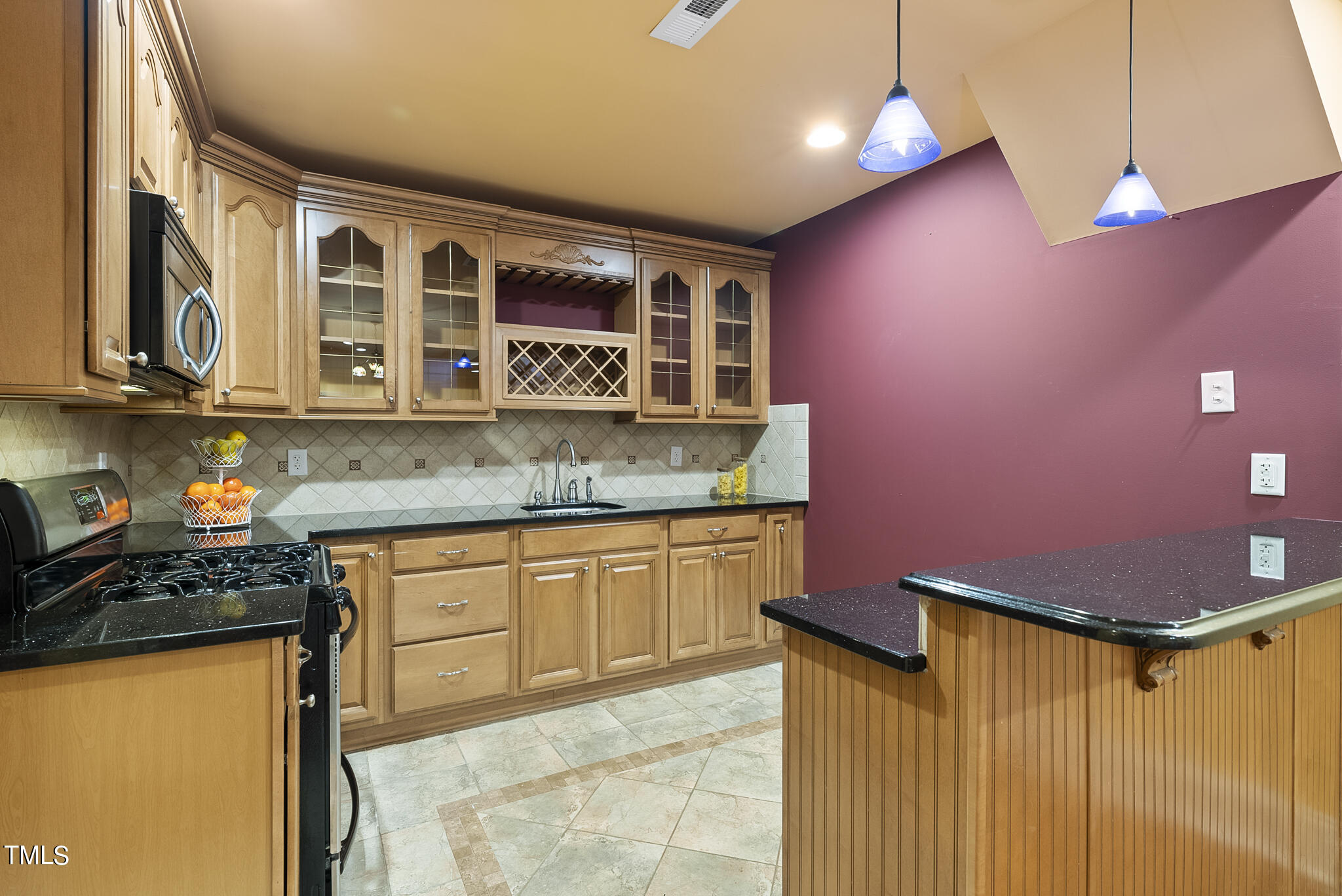 5509 Killarney Hope Drive Raleigh, NC 27613 - Photo 15 of 77 a kitchen with stainless steel appliances granite countertop a sink and cabinets