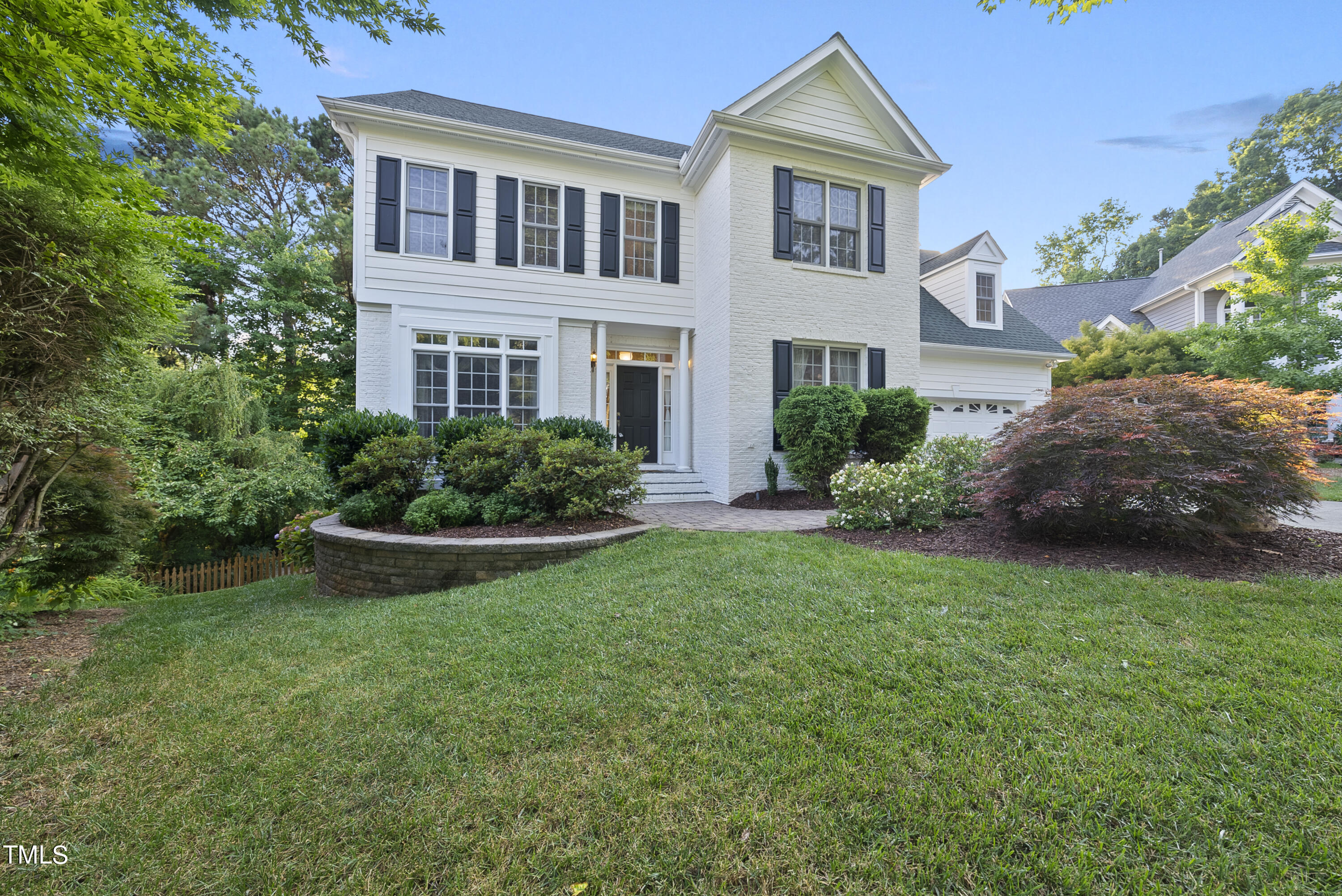 5509 Killarney Hope Drive Raleigh, NC 27613 - Photo 20 of 77 a front view of a house with a yard and garage