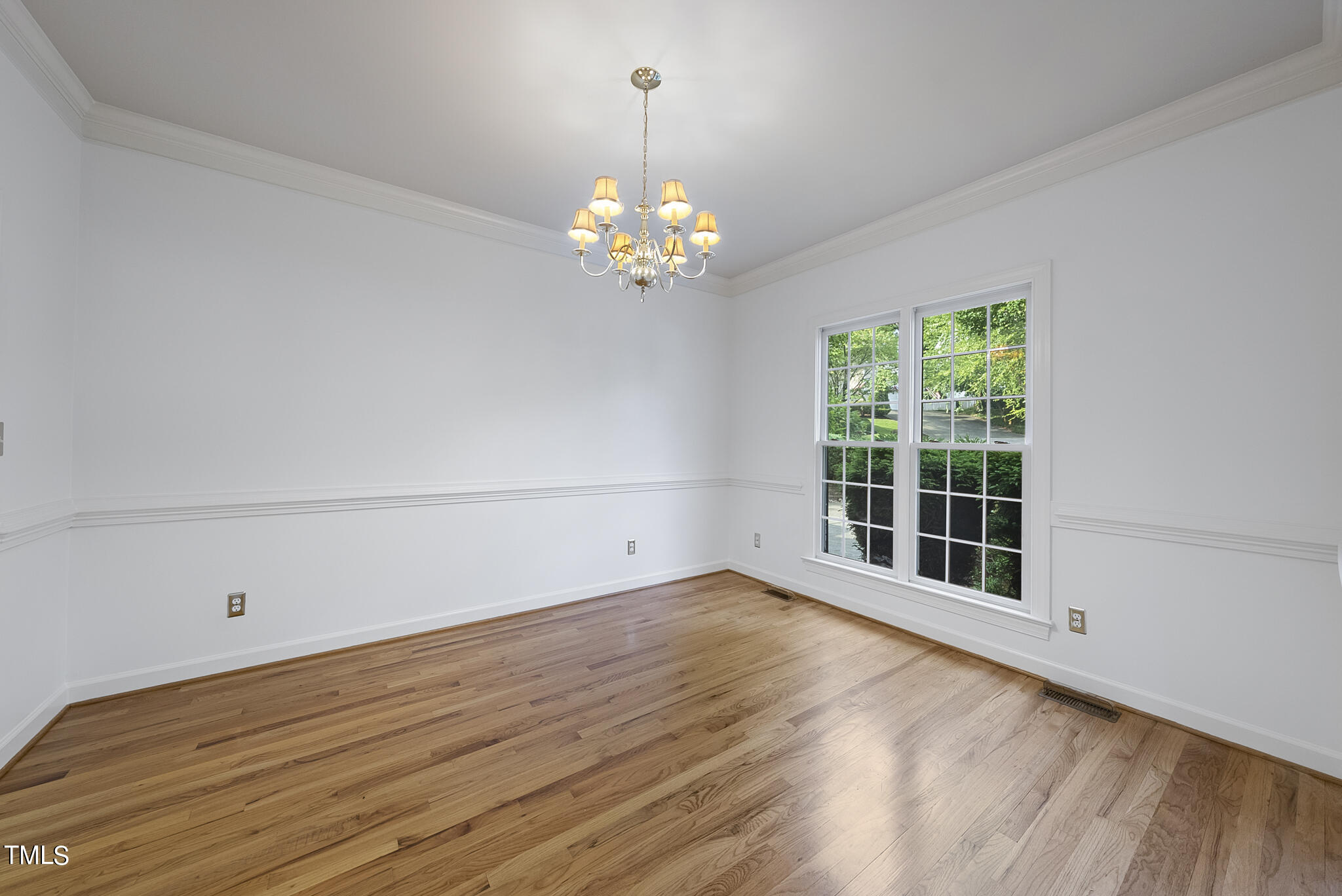 5509 Killarney Hope Drive Raleigh, NC 27613 - Photo 21 of 77 a view of wooden floor in an empty room with a window