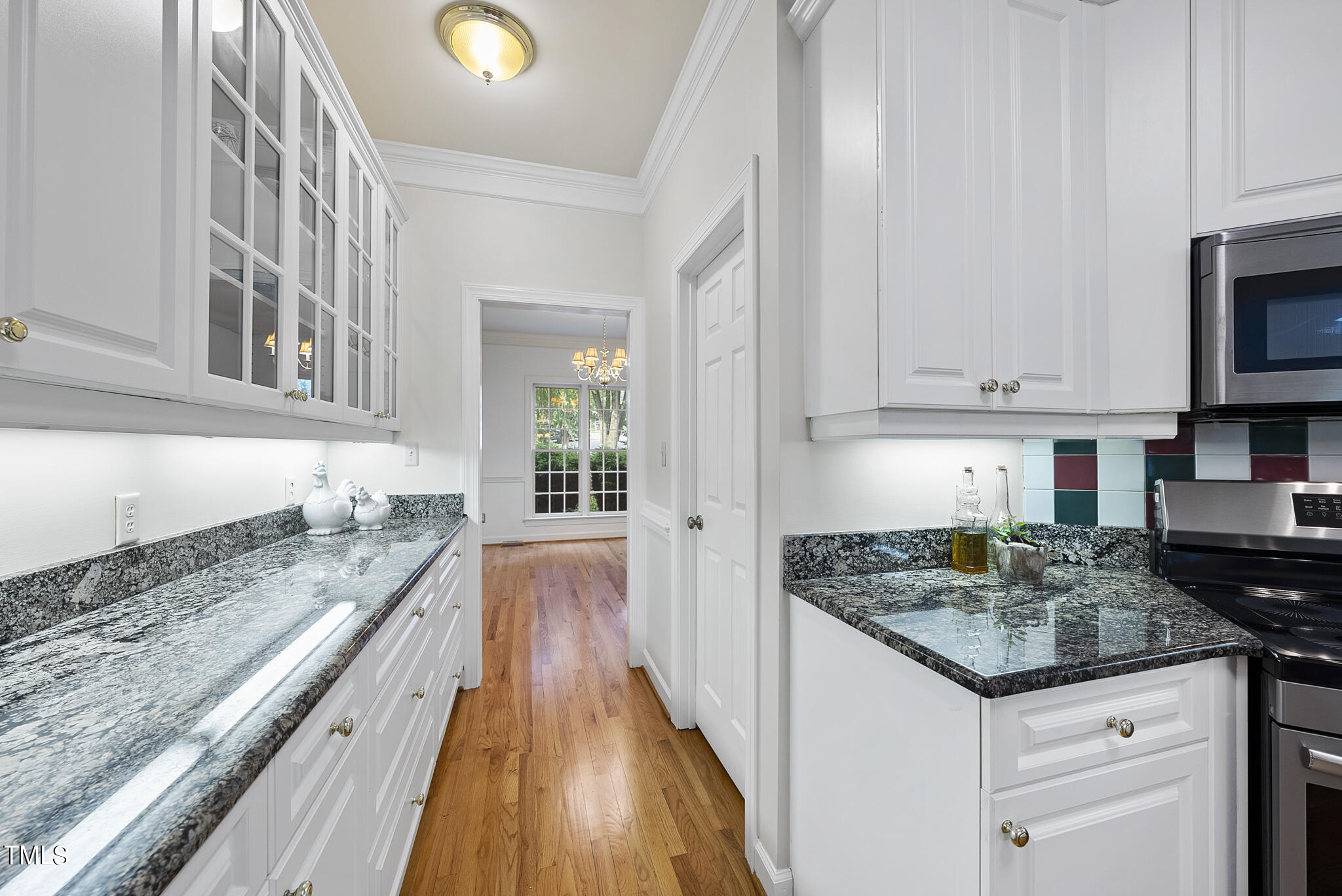 5509 Killarney Hope Drive Raleigh, NC 27613 - Photo 28 of 77 a kitchen with granite countertop a sink and a stove