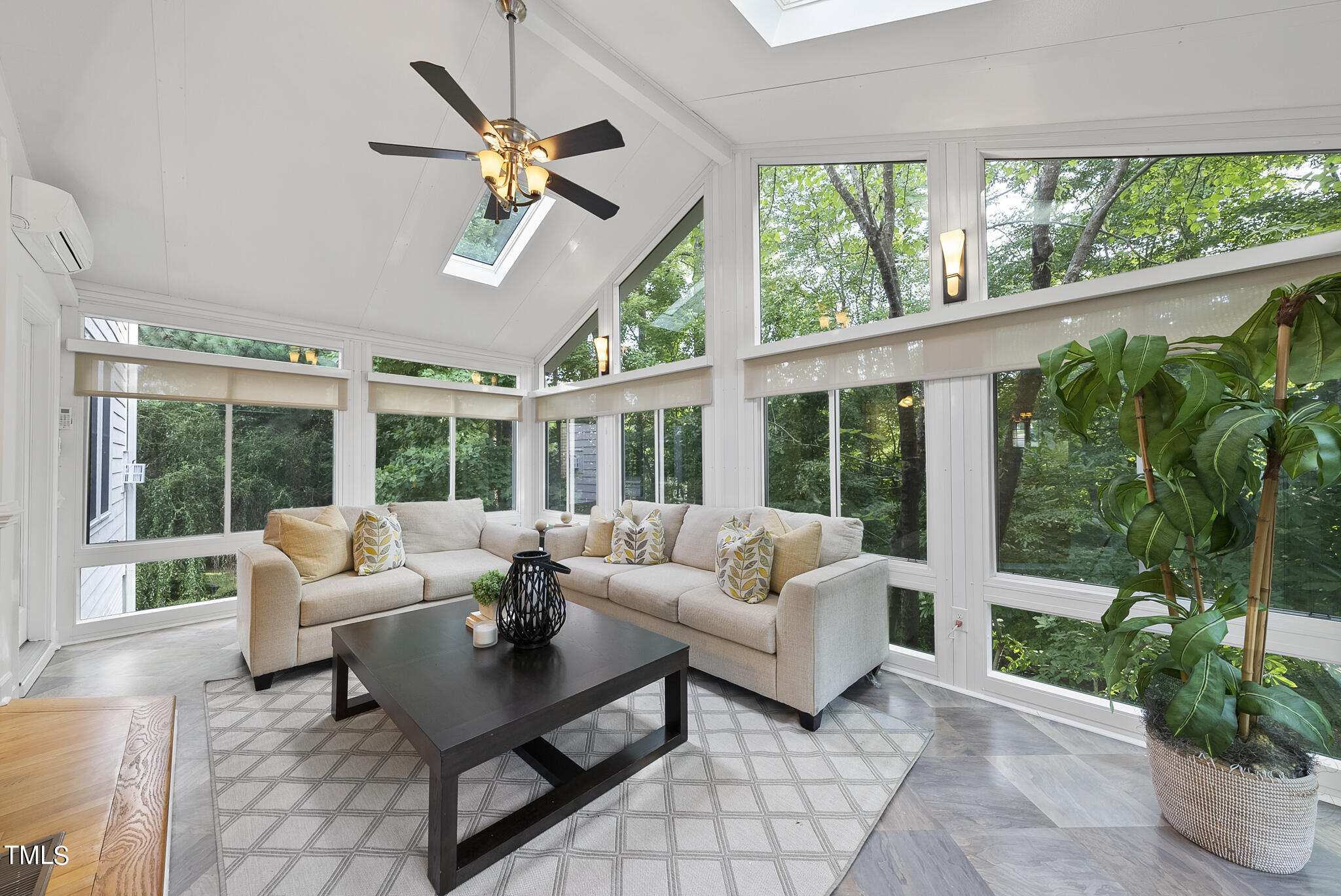 5509 Killarney Hope Drive Raleigh, NC 27613 - Photo 32 of 77 a living room with furniture and a large window