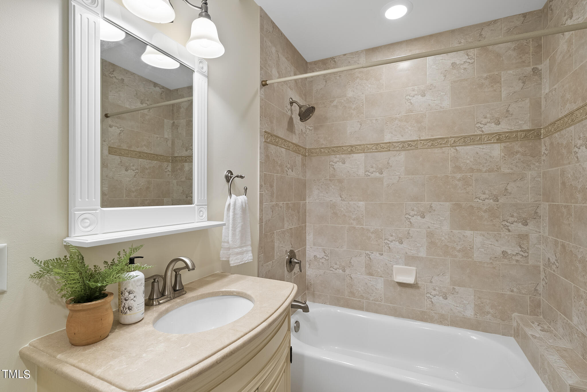 5509 Killarney Hope Drive Raleigh, NC 27613 - Photo 48 of 77 a bathroom with a sink and a mirror