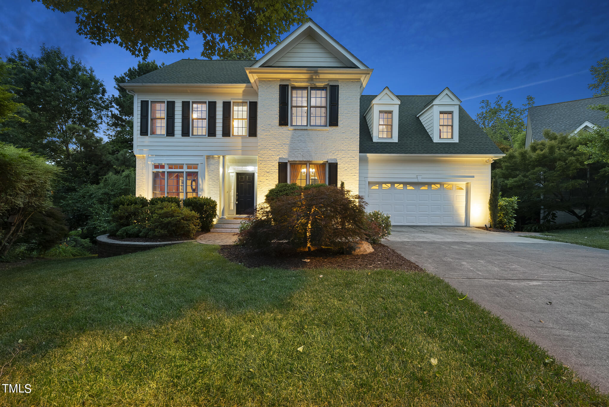 5509 Killarney Hope Drive Raleigh, NC 27613 - Photo 61 of 77 a front view of a house with a yard and garage