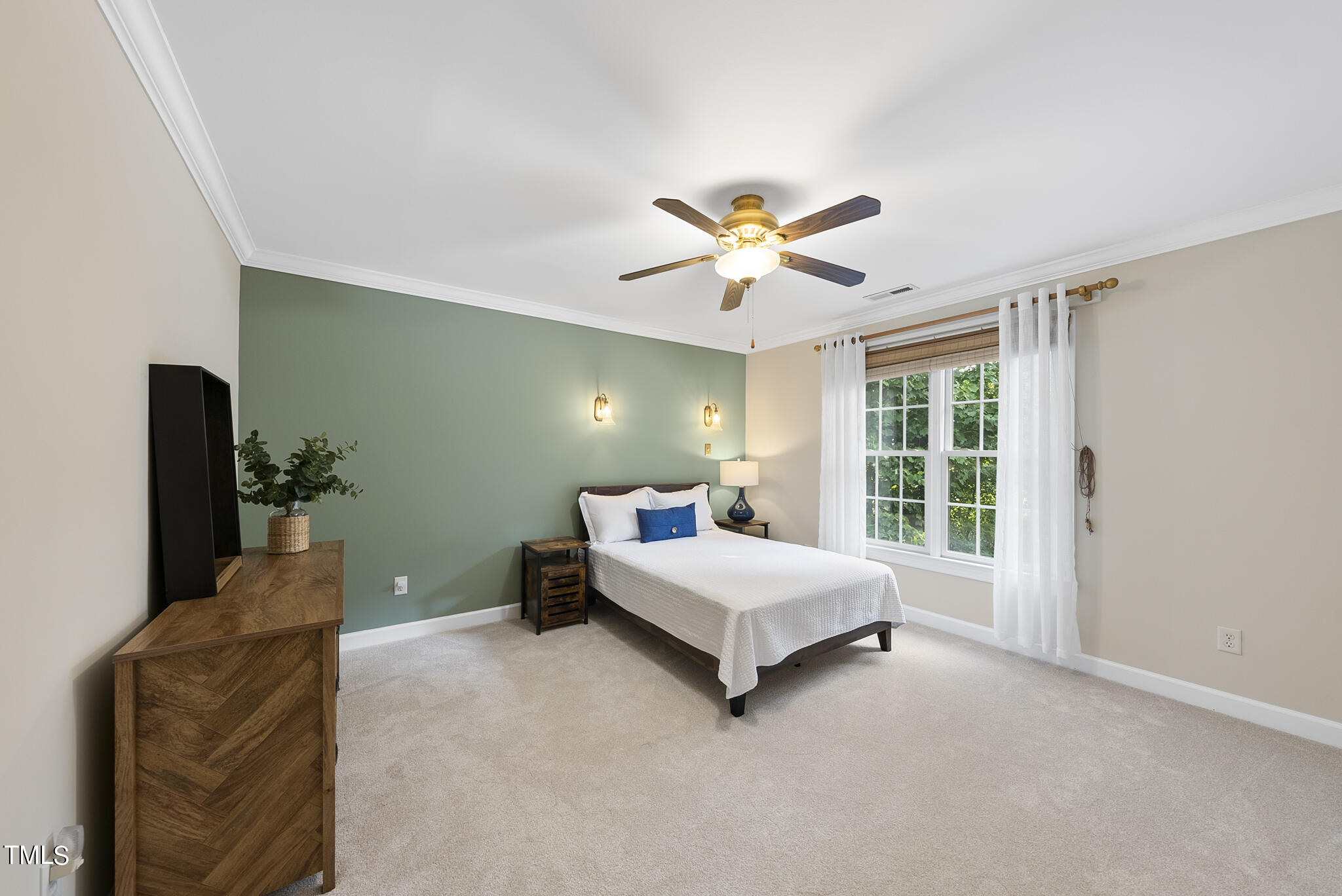 5509 Killarney Hope Drive Raleigh, NC 27613 - Photo 63 of 77 a living room with a bed furniture and a large window