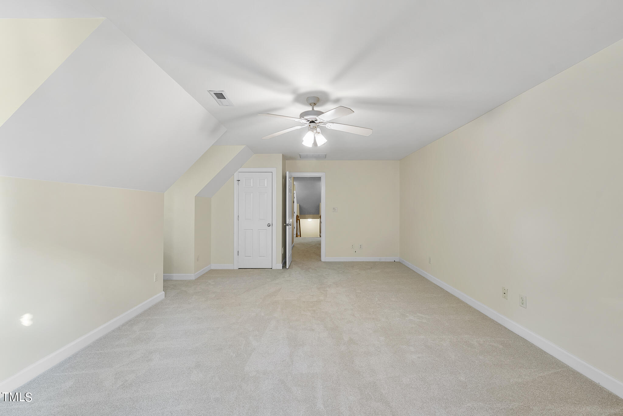 5509 Killarney Hope Drive Raleigh, NC 27613 - Photo 68 of 77 an empty room with a ceiling fan and a window