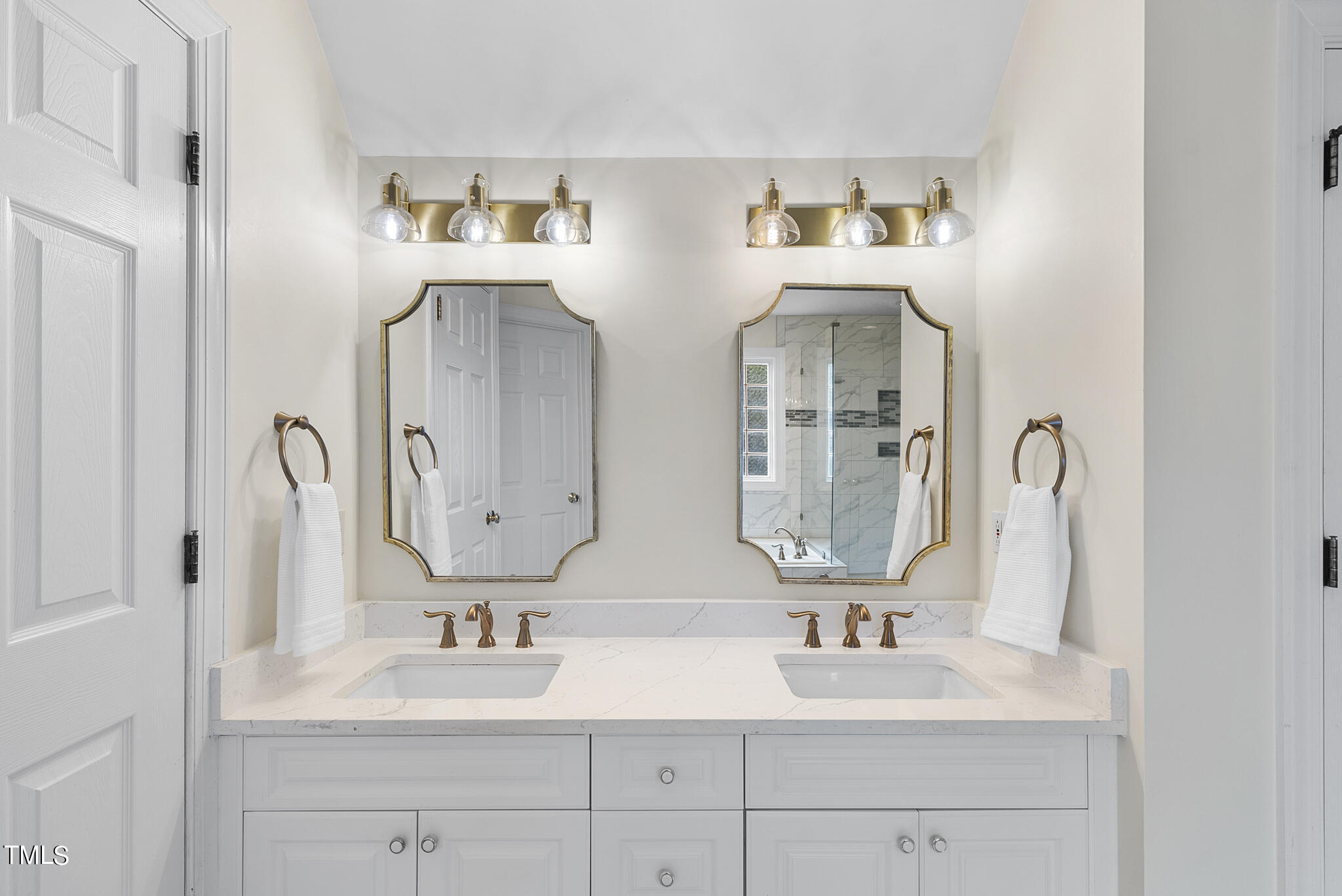 5509 Killarney Hope Drive Raleigh, NC 27613 - Photo 10 of 77 a bathroom with double vanity sinks and two mirror