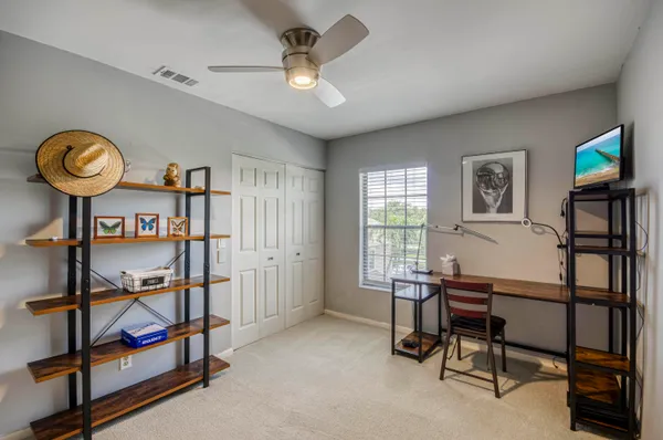 a view of a livingroom with furniture and a window