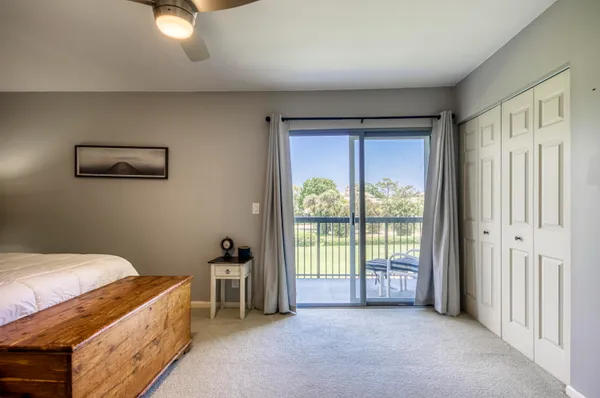 a bed room with a bed and a window