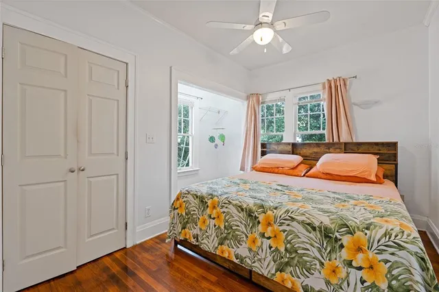 a bed sitting in a bedroom next to a window