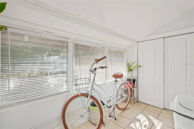 a view of front door with a table and a chair