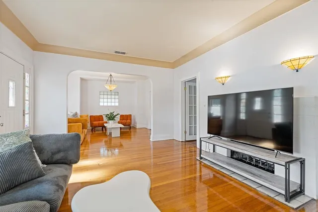 a living room with furniture and a flat screen tv