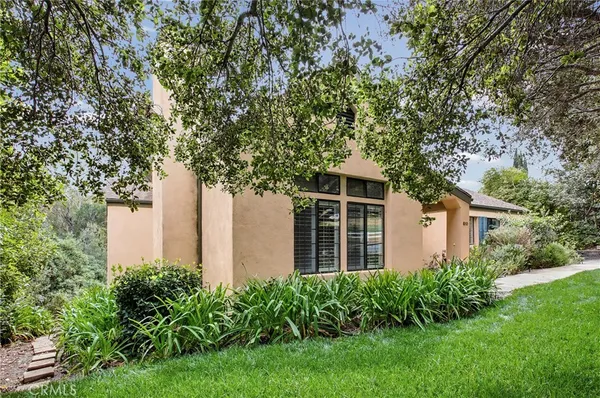 a house with a tree in front of it