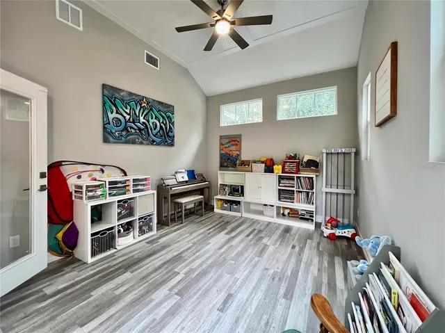 a view of a livingroom with furniture and a window