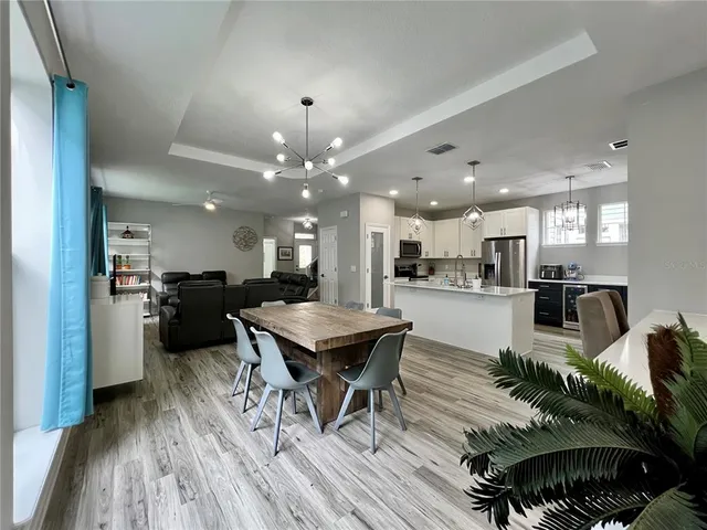 a kitchen with a table and chairs in it
