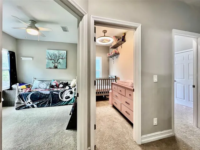 a bedroom with bed and a window