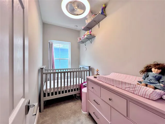 a bedroom with furniture and a window