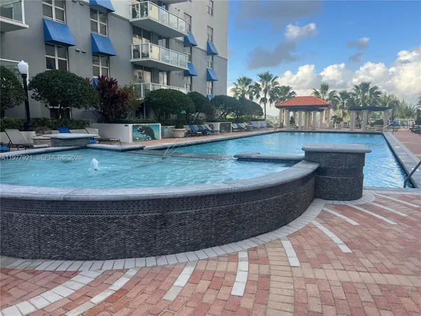 a view of a swimming pool with a patio