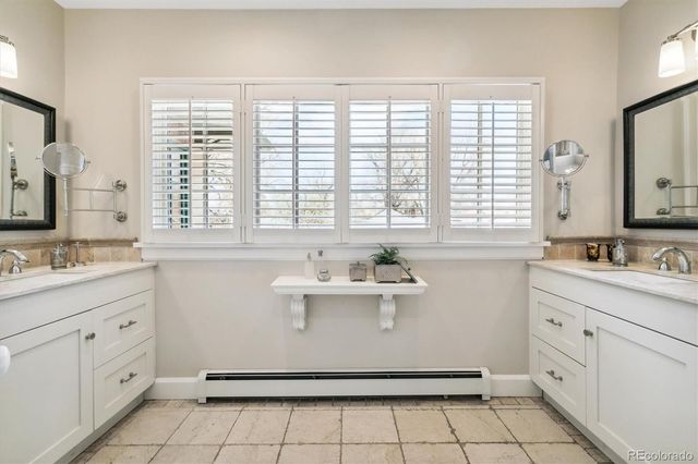 a bathroom with a sink toilet and tub
