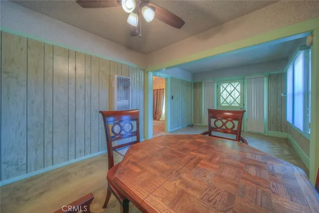 a bed room with a bed and a chair