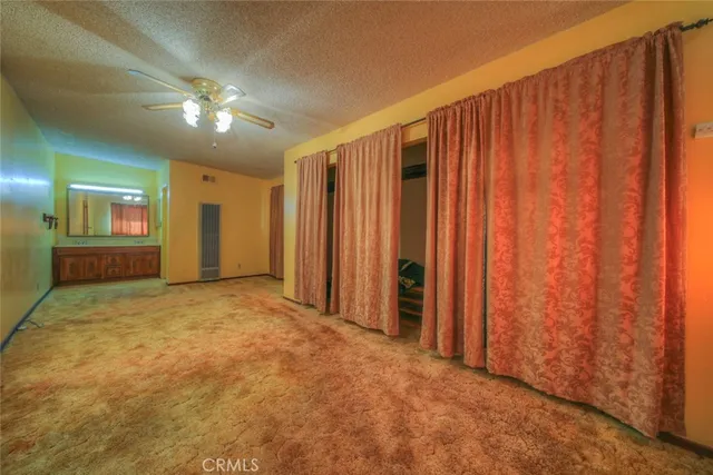 a view of an empty room and a window