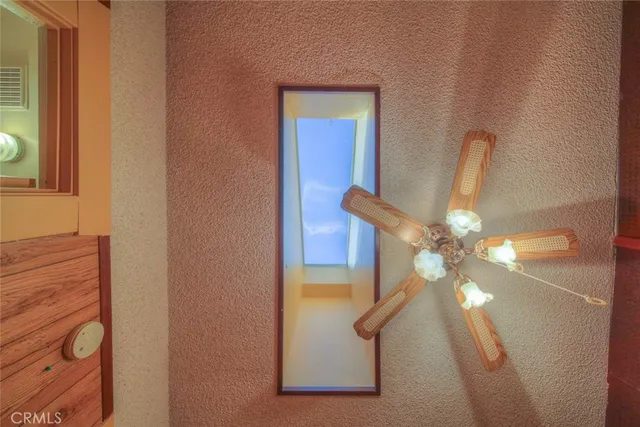 a view of a kitchen with a large window