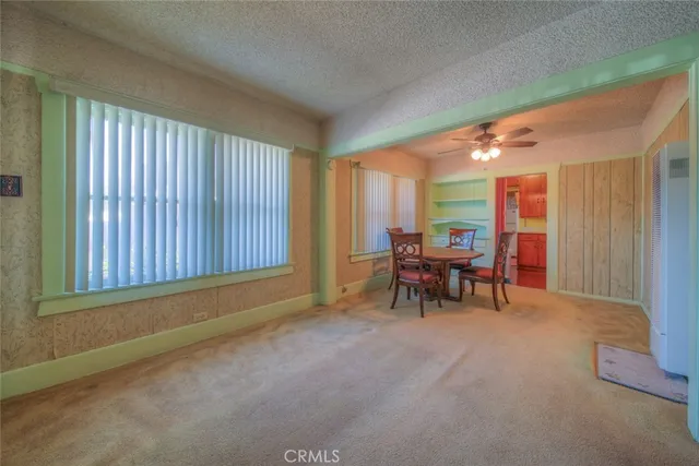 a view of a livingroom with furniture and a window