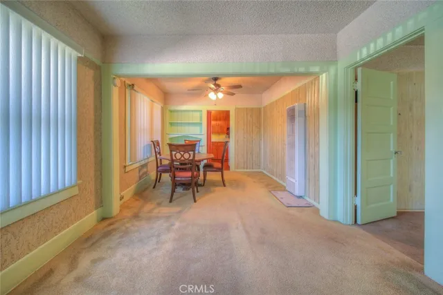 a view of a room with furniture and a window