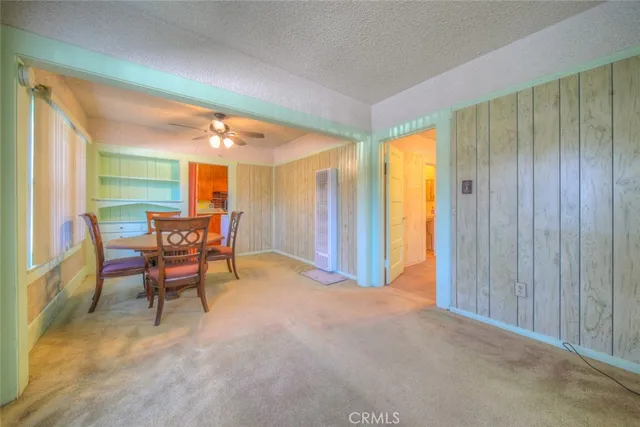 a view of a room with furniture and a window