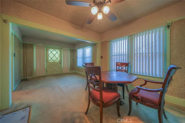 a view of a room with furniture and window
