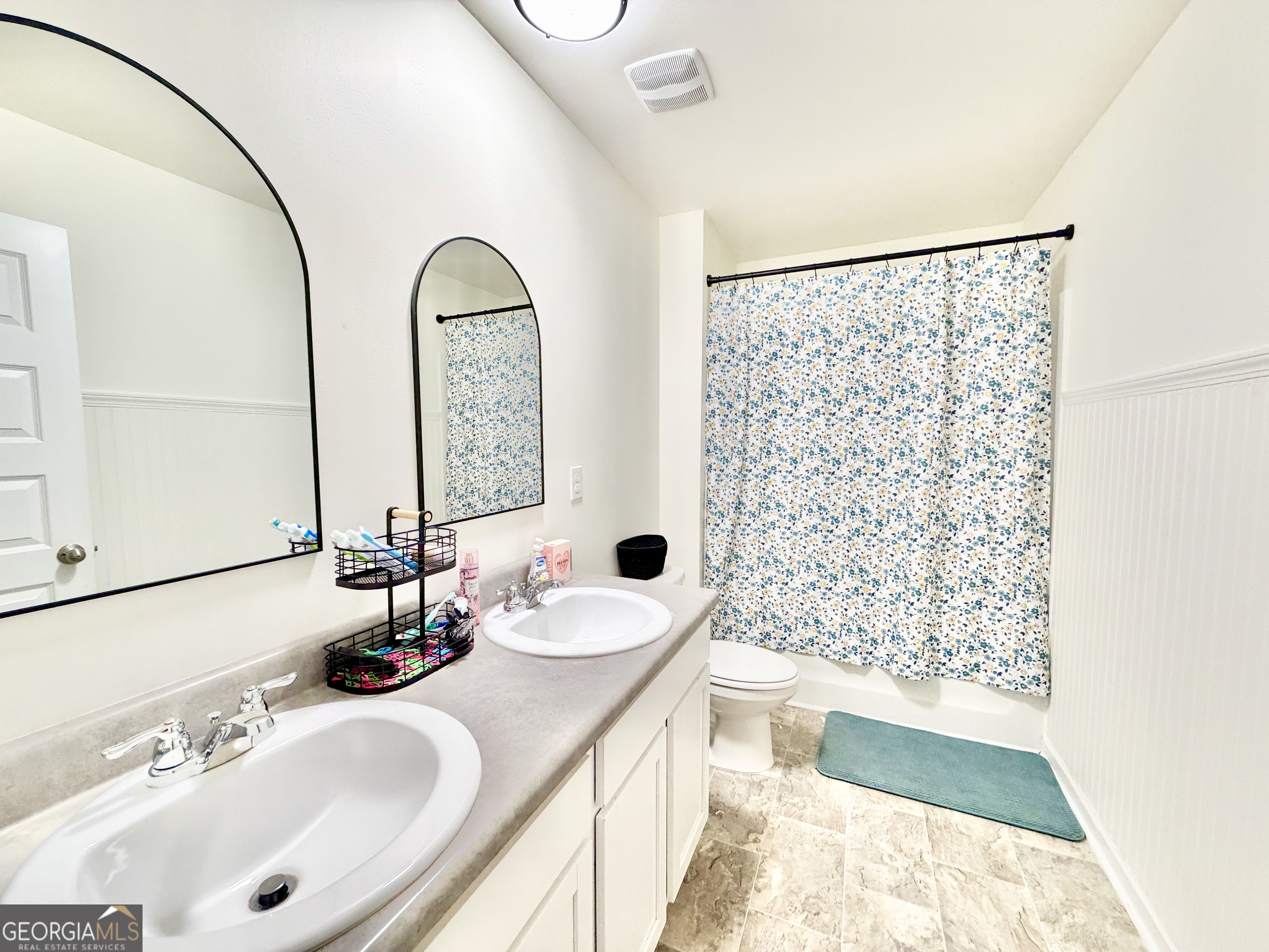 219 Barnyard Way Perry, GA 31069 - Photo 31 of 44 a bathroom with a double vanity sink mirror and shower