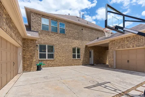 a view of a brick house with a large windows