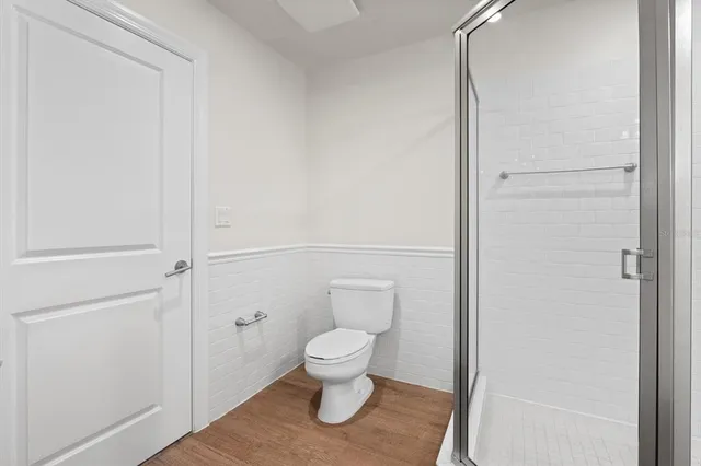 a bathroom with a shower sink and mirror