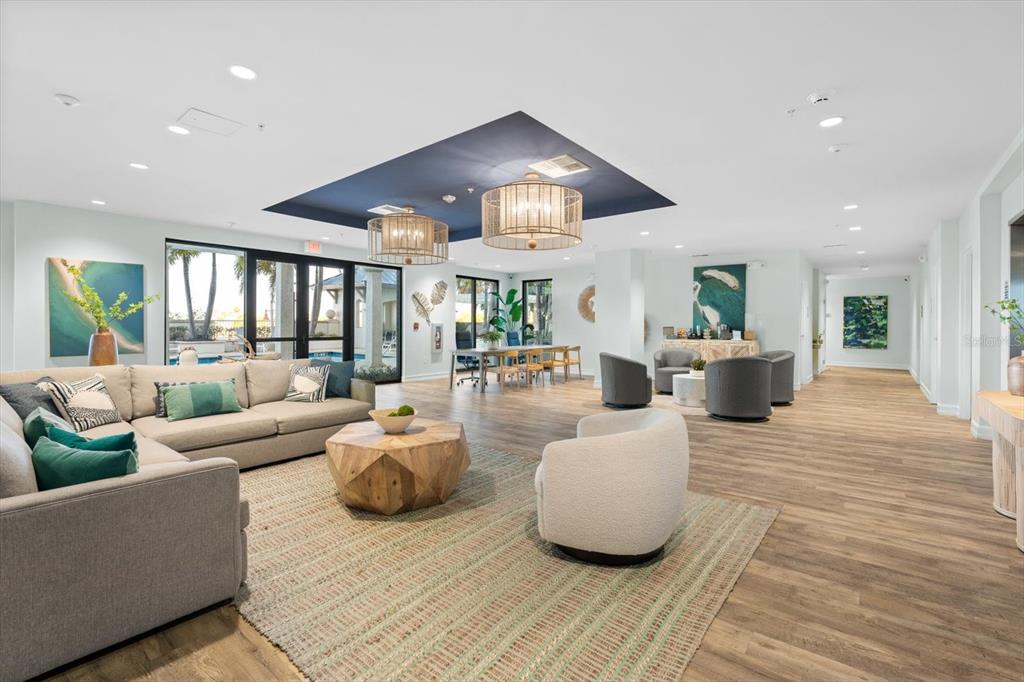 536 Bahia Beach Boulevard, Unit 102A Ruskin, FL 33570 - Photo 23 of 28 a living room with furniture and a chandelier