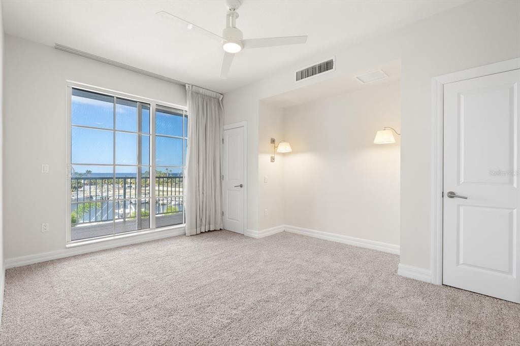 536 Bahia Beach Boulevard, Unit 102A Ruskin, FL 33570 - Photo 7 of 28 an empty room with windows and closet