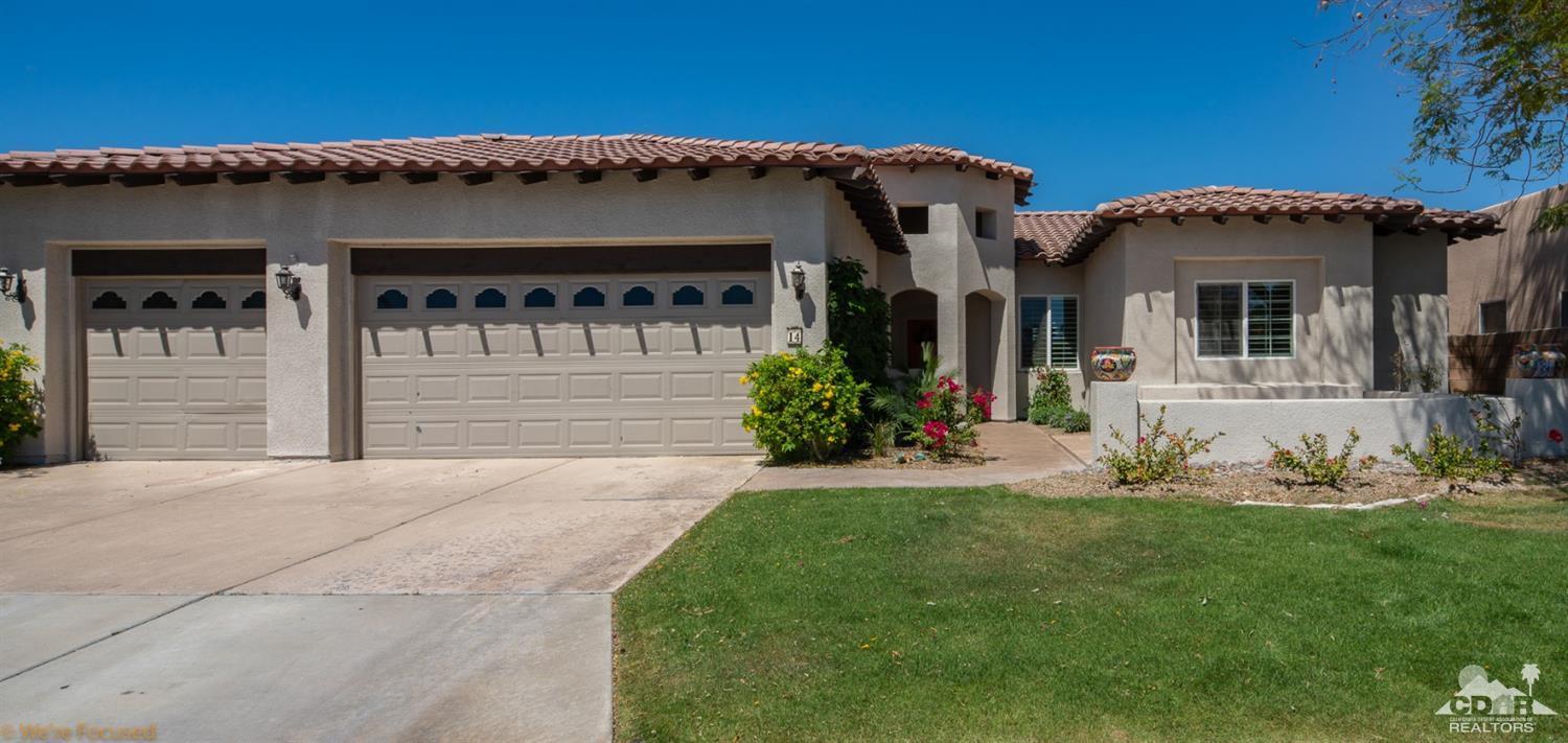 14 Tucson Circle Palm Desert, CA 92211 - Photo 2 of 20 a front view of a house with a yard and garage
