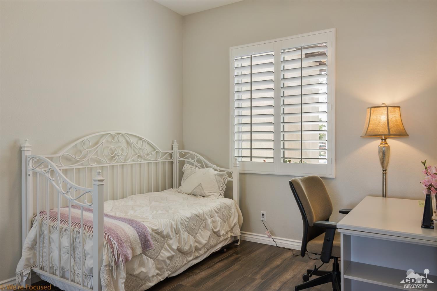 14 Tucson Circle Palm Desert, CA 92211 - Photo 14 of 20 a bedroom with a bed chair and window