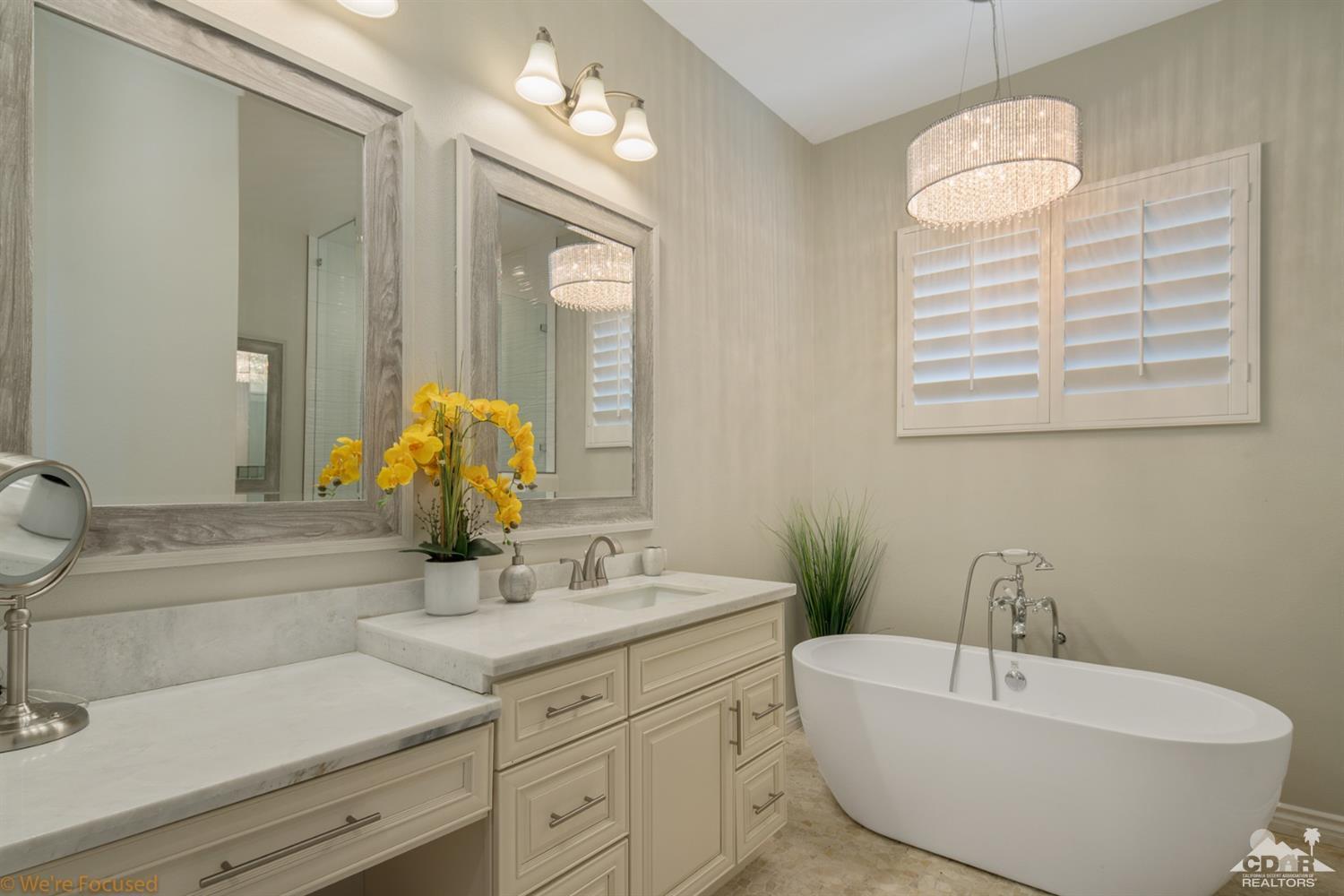 14 Tucson Circle Palm Desert, CA 92211 - Photo 16 of 20 a bathroom with a sink and a mirror