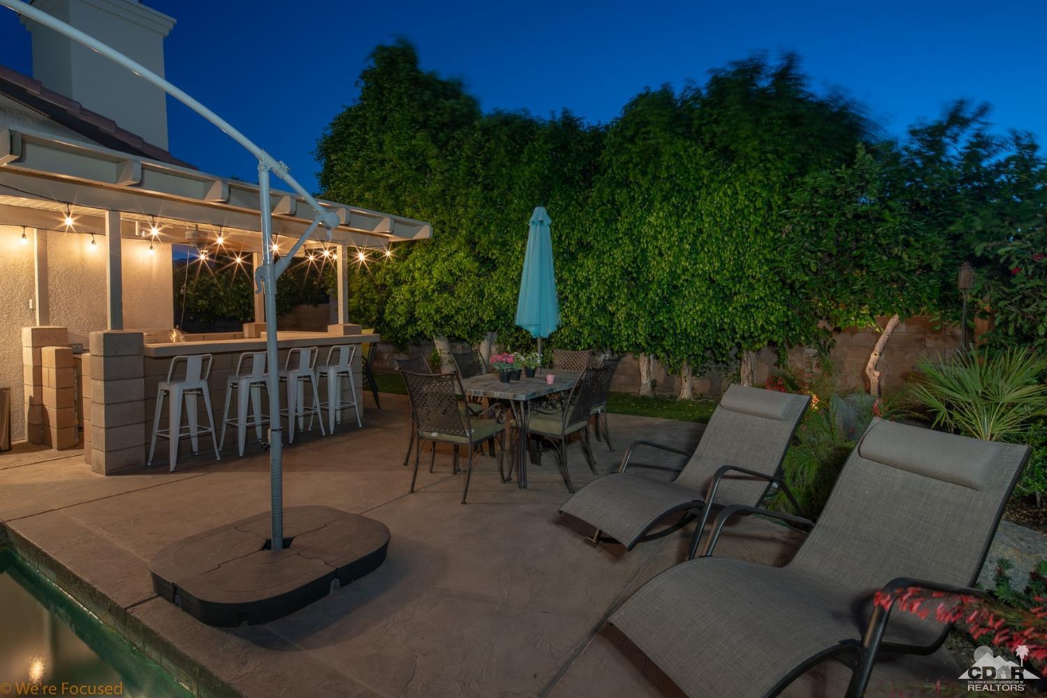 14 Tucson Circle Palm Desert, CA 92211 - Photo 19 of 20 a view of a backyard with sitting area