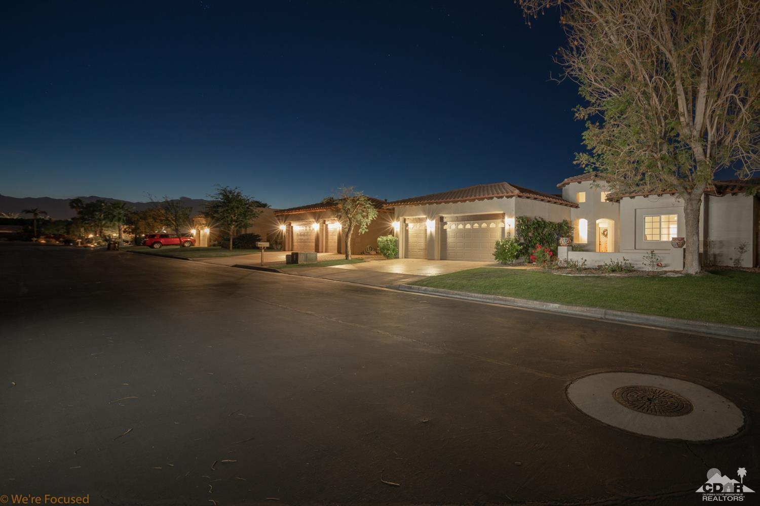 14 Tucson Circle Palm Desert, CA 92211 - Photo 5 of 20 a view of street and house with green space