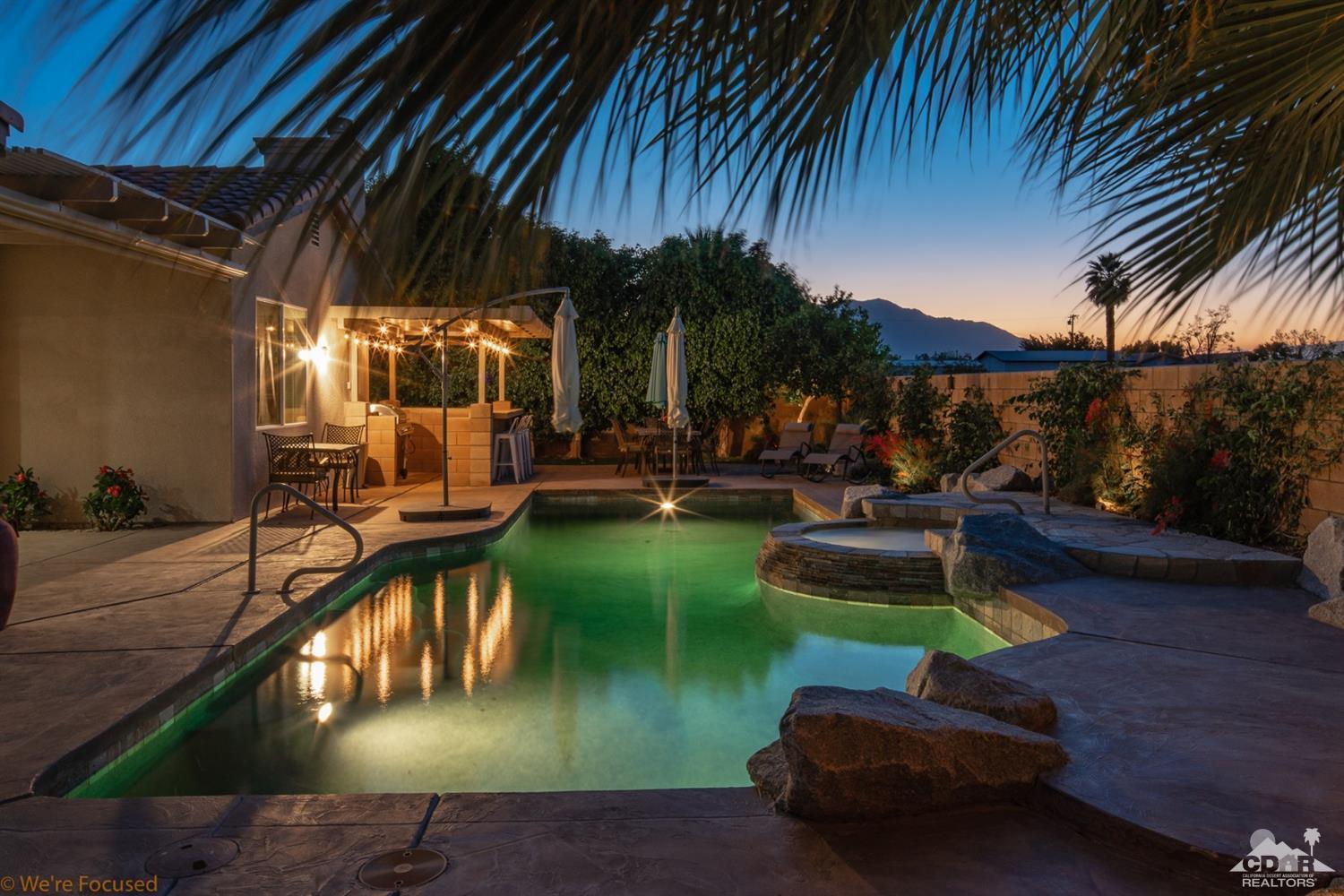 14 Tucson Circle Palm Desert, CA 92211 - Photo 6 of 20 a view of a swimming pool with a patio