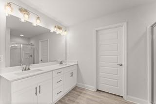 636 Bald Ridge Circle Demorest, GA 30535 - Photo 28 of 35 a bathroom with a double vanity sink and a mirror